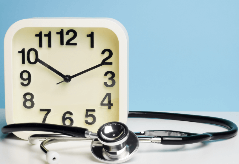 Analog clock with doctor's stethoscope