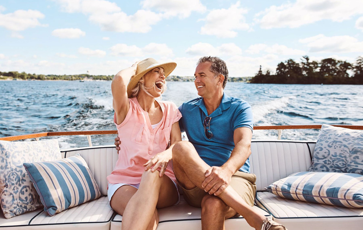 Couple laughing together on boat