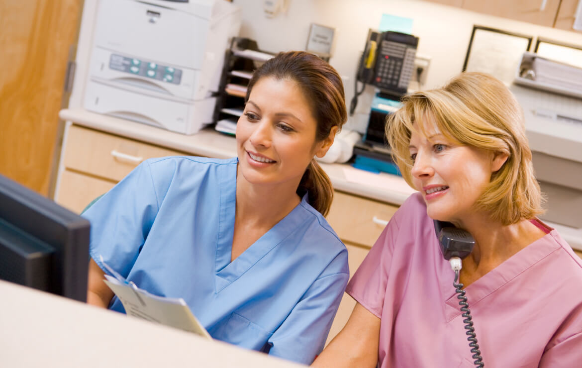 Nurses sitting together in office room