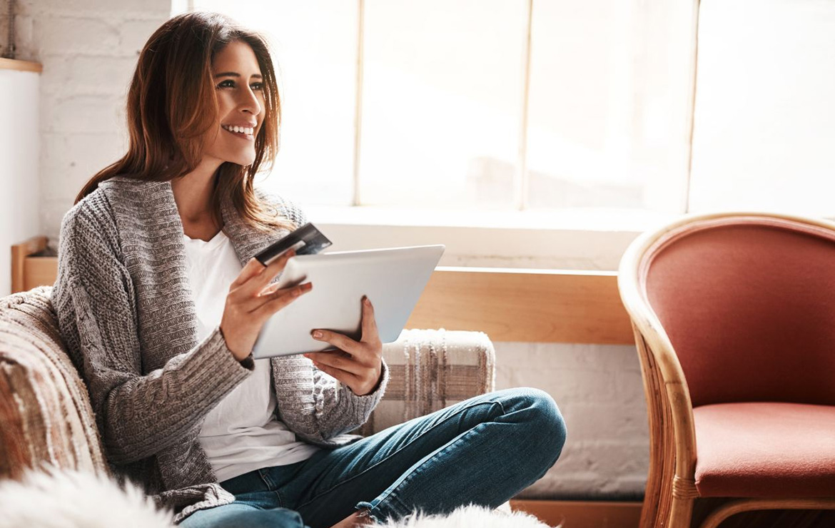 https://www.sharphealthplan.com/images/default-source/site-images/hero-images/smiling-woman-holding-credit-card-and-tablet-1170x740.jpg?sfvrsn=6214a080_3