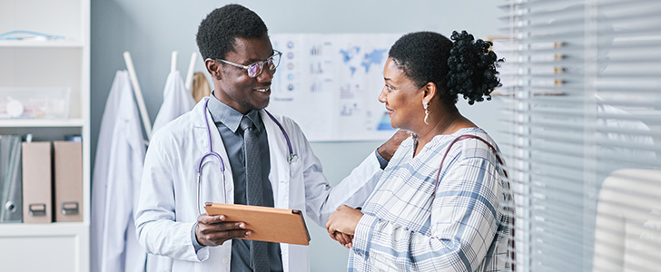 Doctor and patient smiling at each other