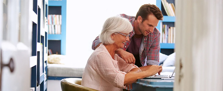 Son helping mother with choosing a Medicare plan