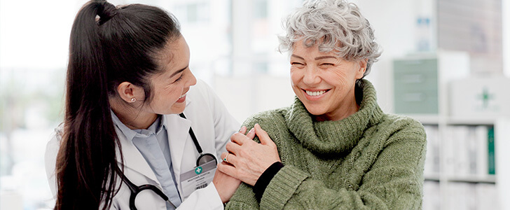 Doctor placing hand on patient's shoulder